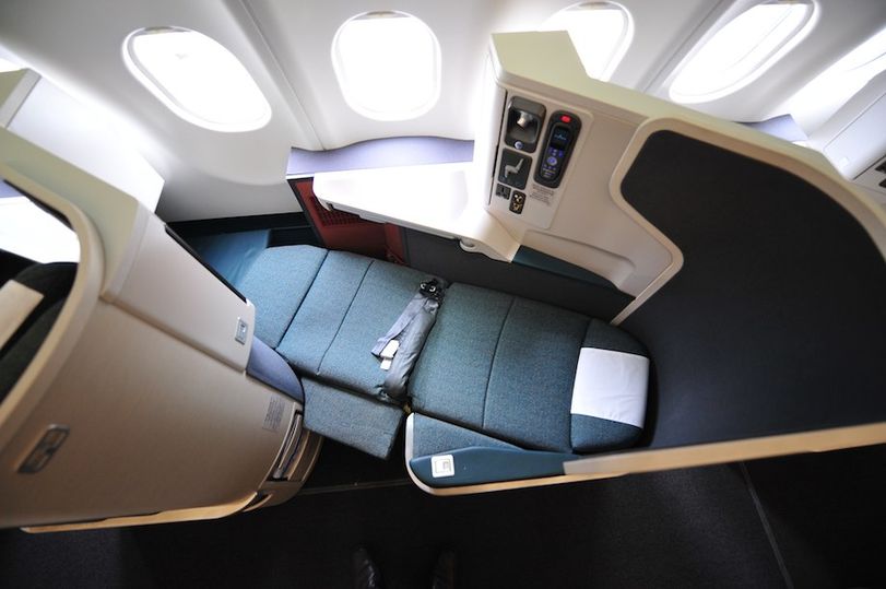 Window seats in Cathay's new business class face outwards, away from the aisle.